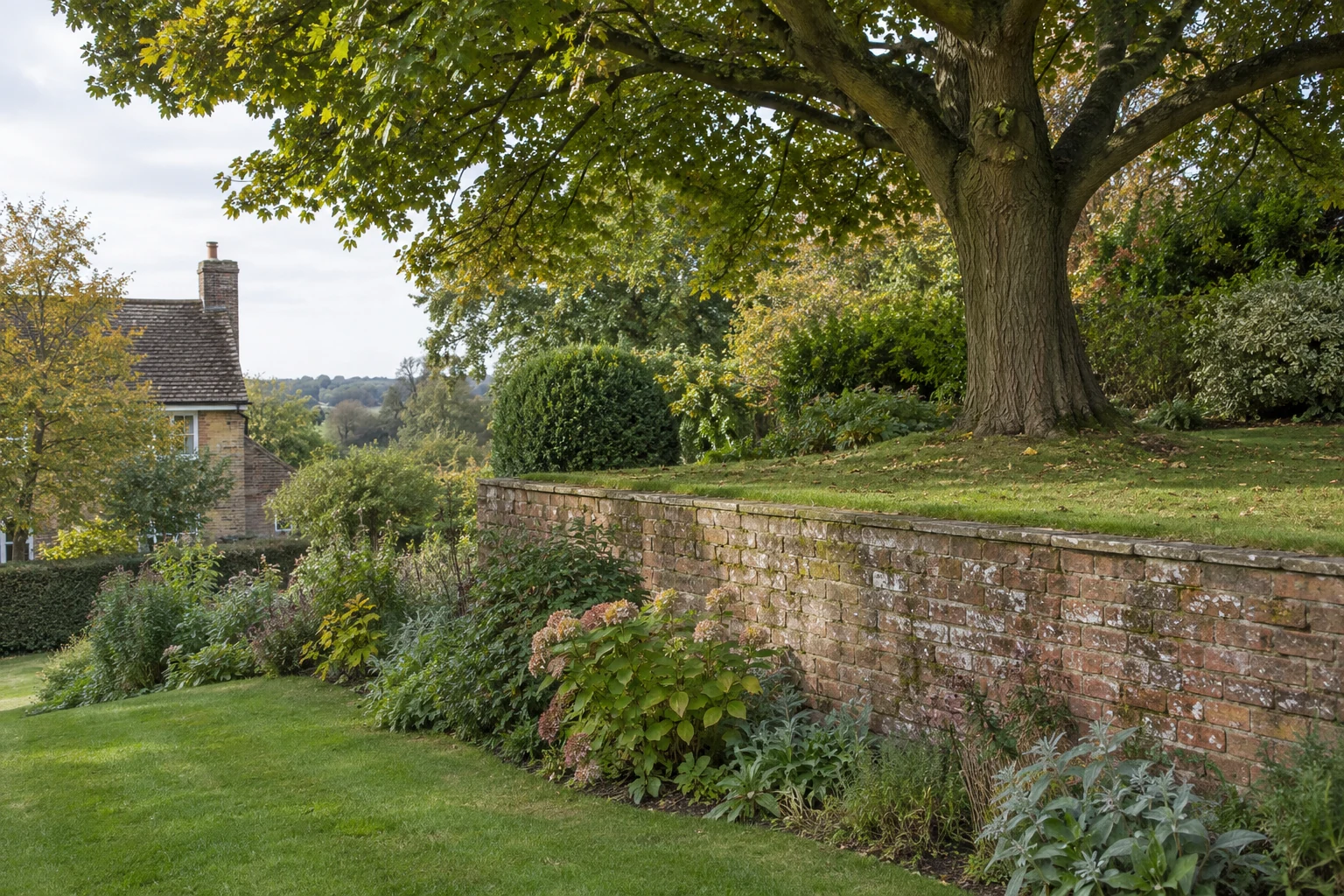 Illustrative AI-generated photograph: A quiet English sloping garden with a modest old brick retaining wall and mature tree on the upper garden level